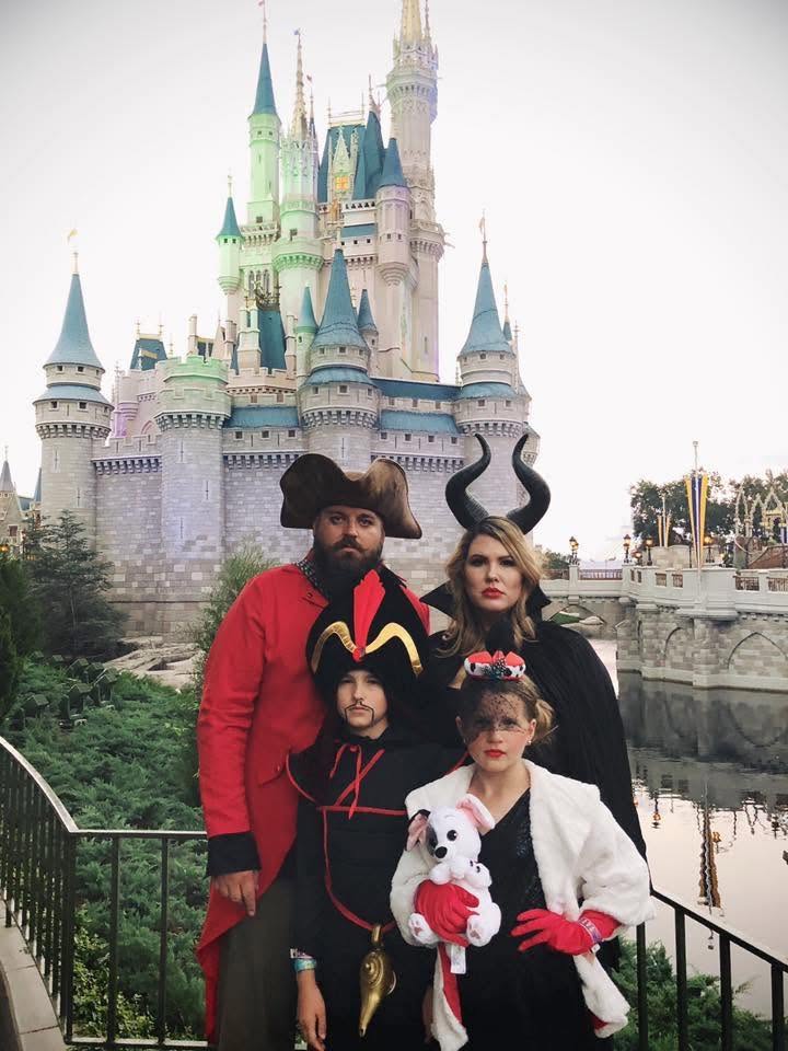 JohnMichael Morgan and family in villain costumes at Disney's Magic Kingdom